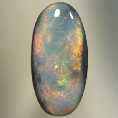 SOLID SEMI BLACK OPAL Glowing with a red Sheen pattern over blue
